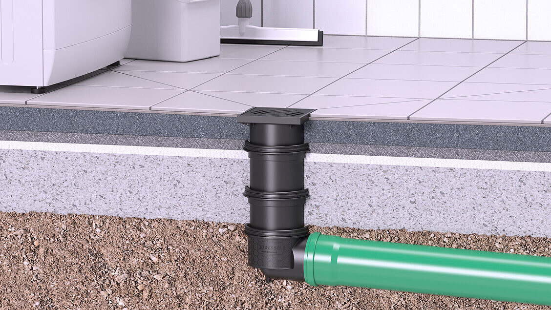 Kelderafvoer die door de betonnen vloer loopt en in de grond wordt afgevoerd.