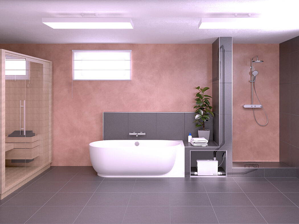 Kelderruimte met sauna, badkuip en douche. De afvoerleidingen zijn aangesloten op een kleine opvoerinstallatie.