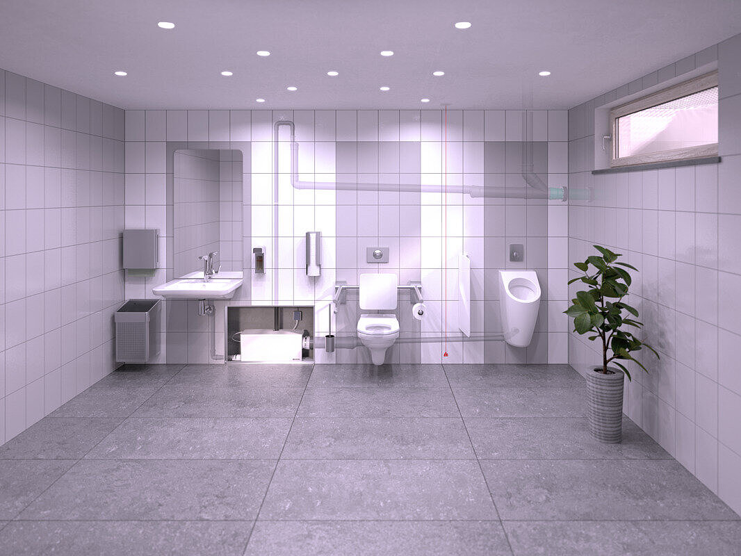 Weergave van de inbouw van een restauranttoilet in de kelder, waarbij een wastafel, een urinoir en een toilet zijn aangesloten op de kleine opvoerinstallatie Minilift L WC Duo, die is weggewerkt in een voorwandinstallatie.